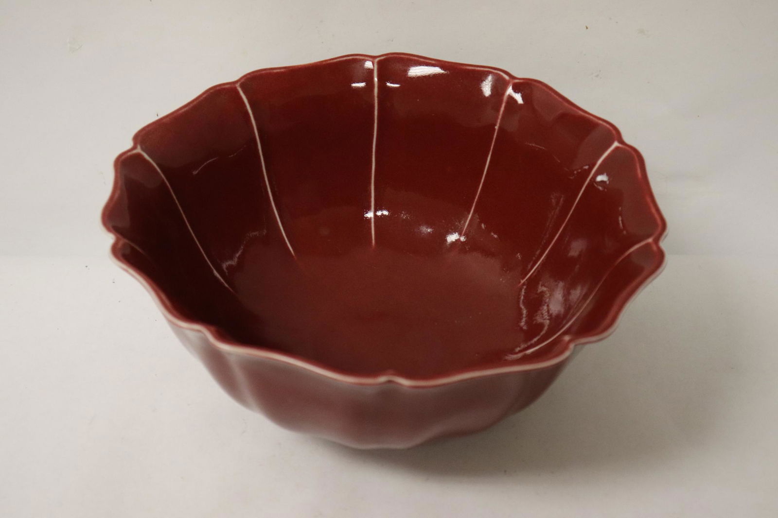 A large red glazed bowl with foliate shape (1 of 10)