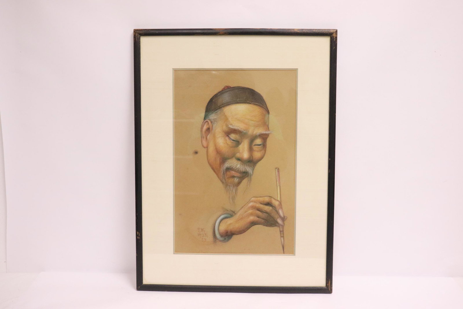 A watercolor/ pastel painting by Wylog Fong, dated: A fine watercolor/ pastel painting depicting Chinese man with calligraphy brush by Chinese/ California artist Wylog Fong, dated 1953
