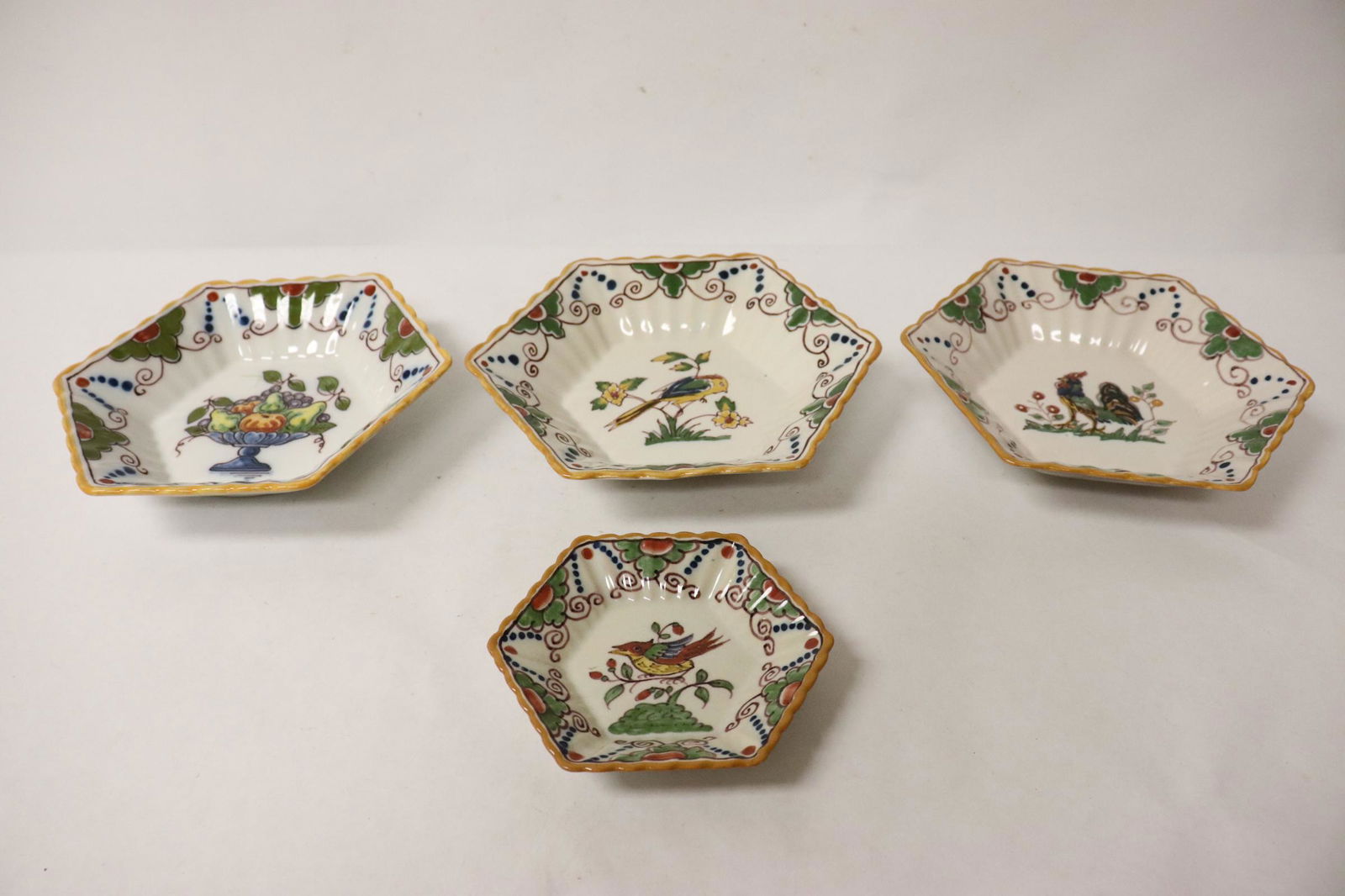 4 French hand painted plates: 4 French hand painted plates, 1.35"Hx6.8"dia(3), 0.8"Hx4.35"dia