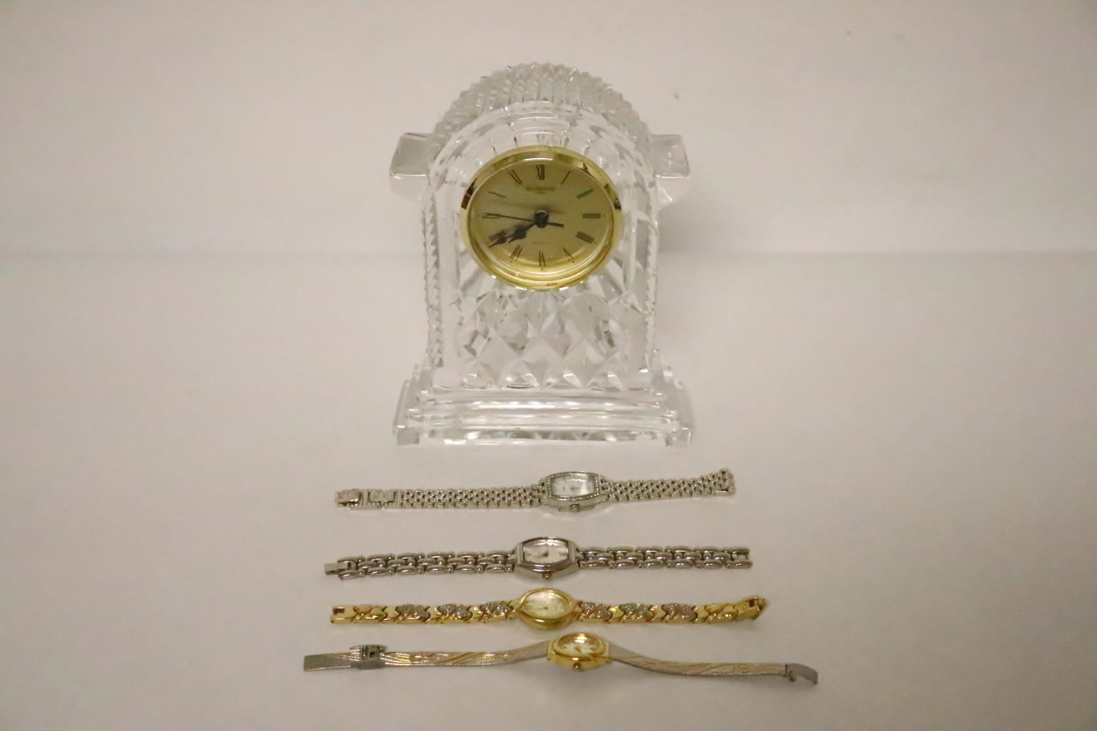 4 ladies watches, and a Waterford crystal clock: 4 ladies watches, and a Waterford crystal clock (7.2"H)