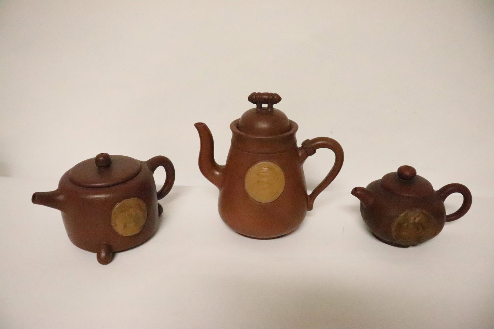 3 Yixing teapots: 3 Yixing teapots, 3.5"Hx5.7"x3.75" - 6.5"Hx6.7"x4.2"