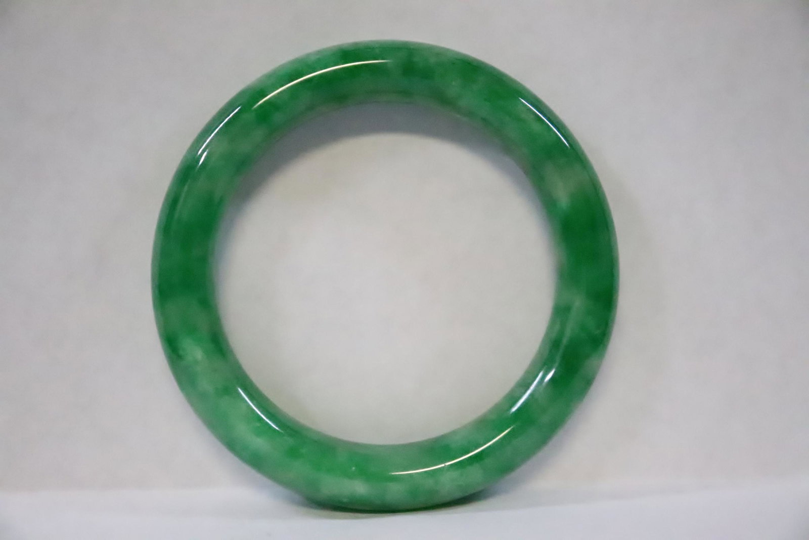 Chinese jadeite like bangle: Chinese jadeite like bangle, 0.48"x3"od(2.2"id)