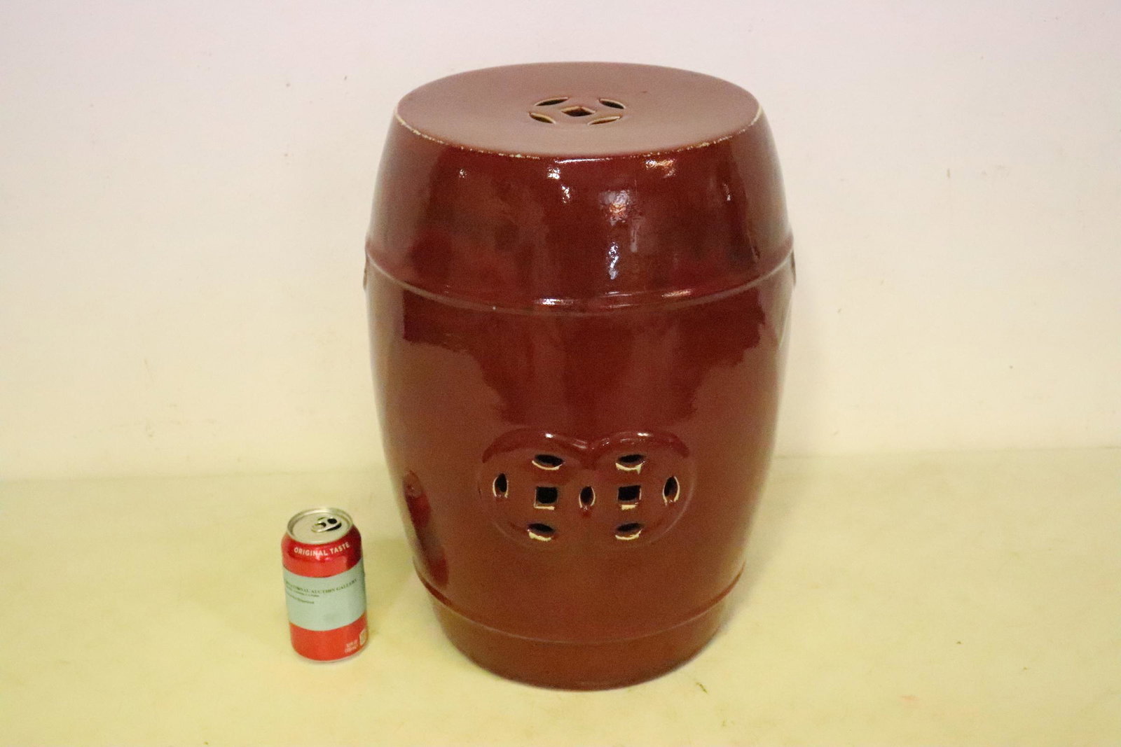 A red glazed porcelain garden stool: A red glazed porcelain garden stool, 18"Hx13"dia