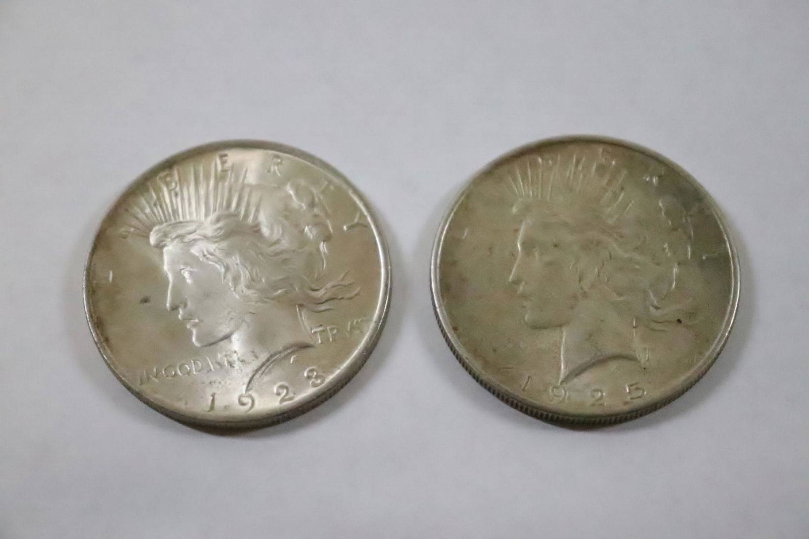 2 silver peace dollars; 1923, 1925 (1 of 9)