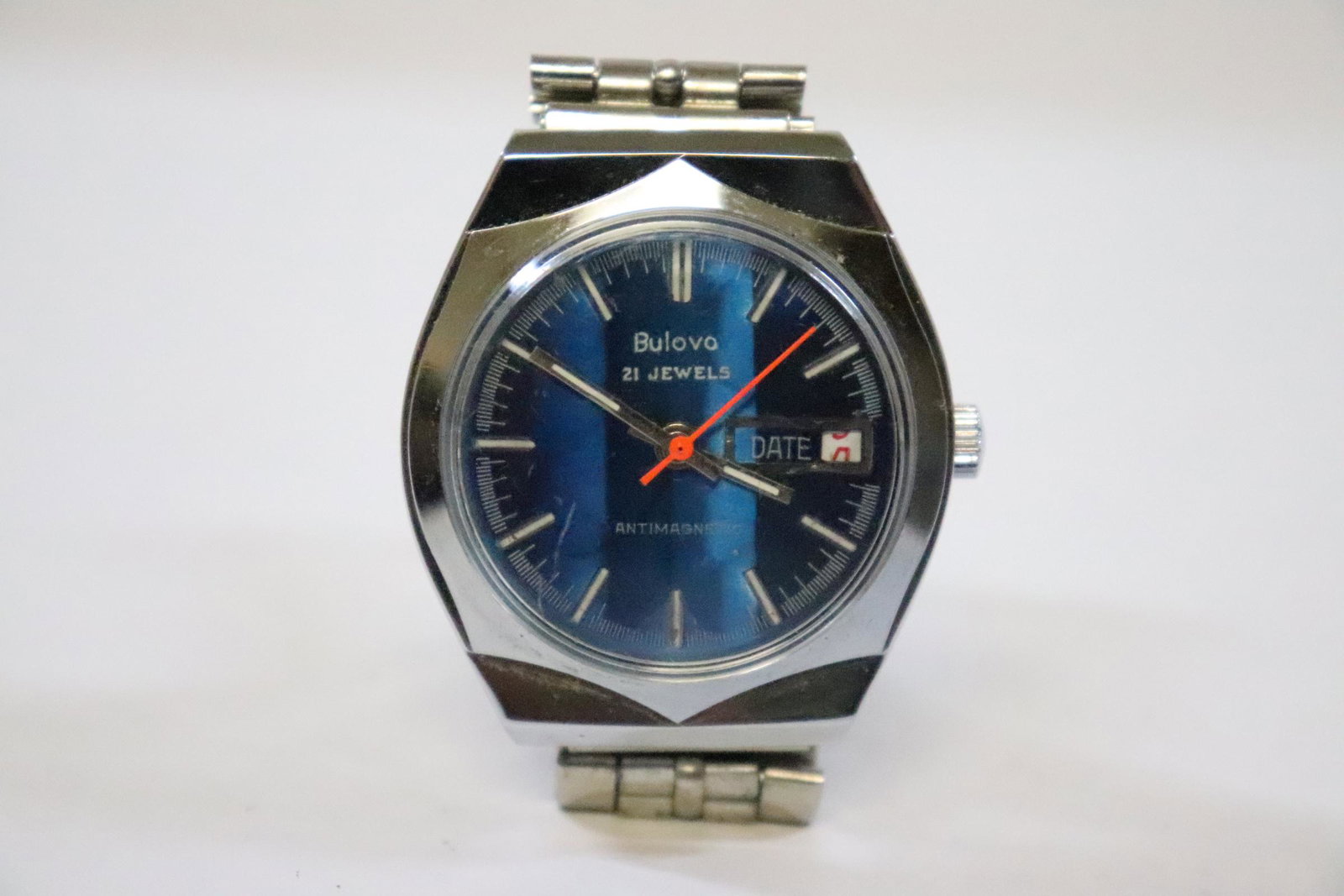 Bulova 21-jewel blue face man's wrist watch: Bulova 21-jewel blue face man's wrist watch, it ticking but we do not know if it keep accurate time