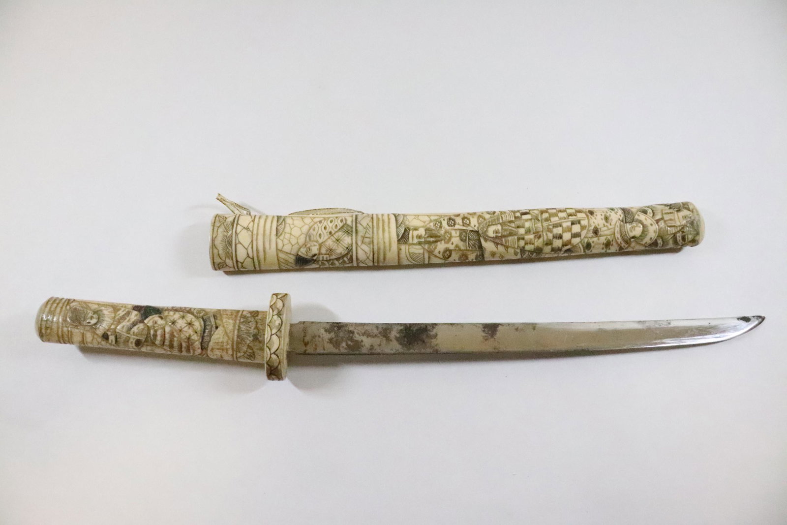 Japanese vintage sword with carved bone scabbard: Japanese vintage sword with finely carved bone scabbard, 19"L