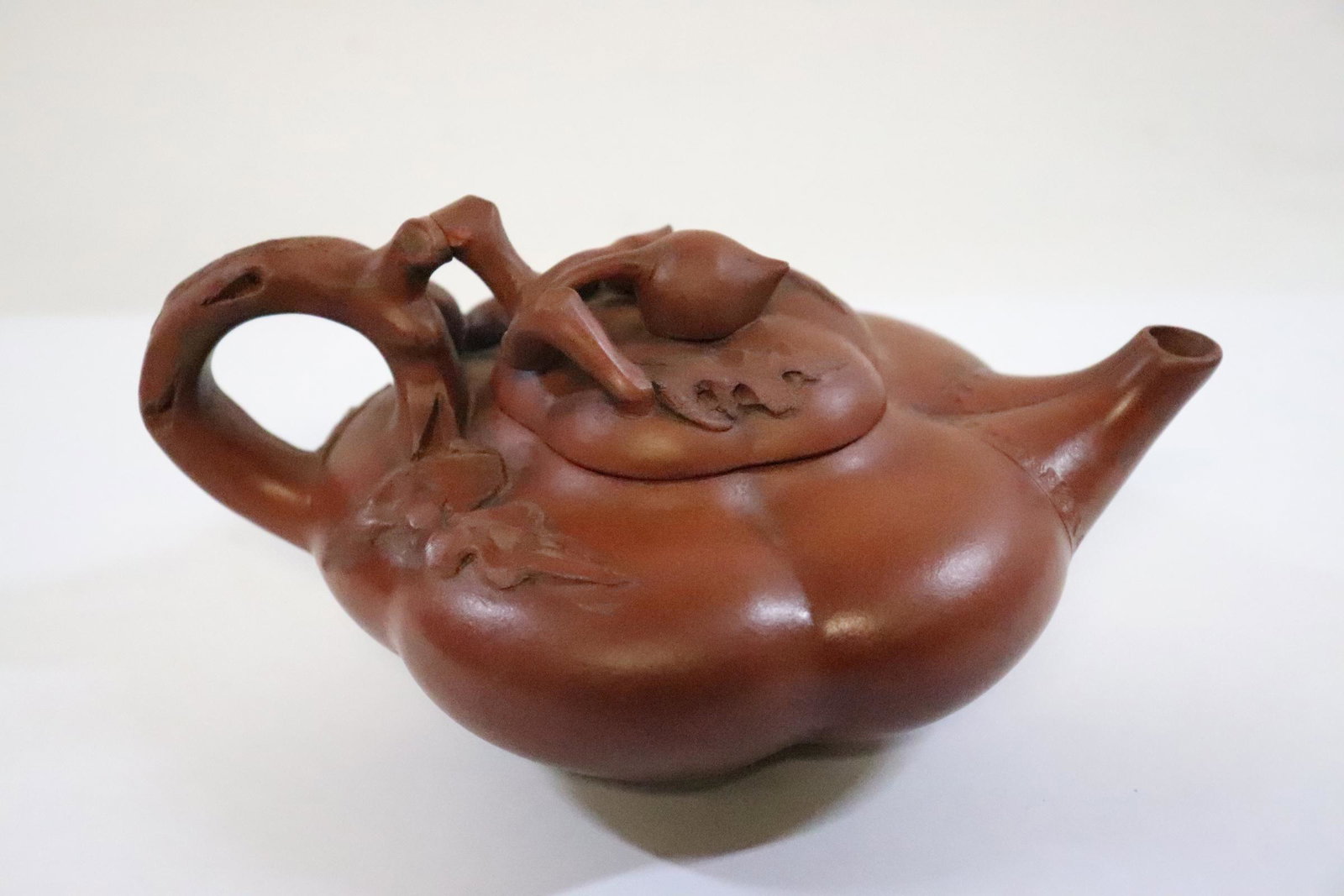 A fancy Yixing teapot: A fancy Yixing teapot, cover chip 3.85"Hx7.65"x5.4"
