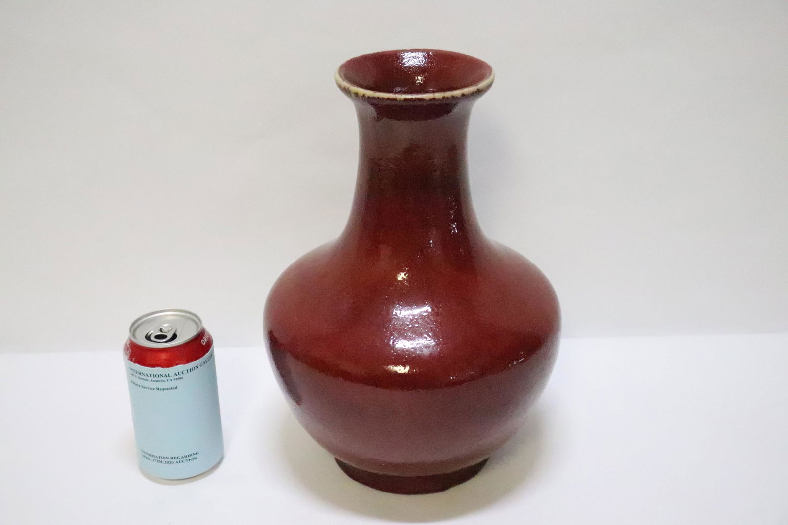 Chinese antique red glazed porcelain jar: A fine Chinese antique red glazed porcelain jar, drilled and filled, 12.25"Hx8.75"dia
