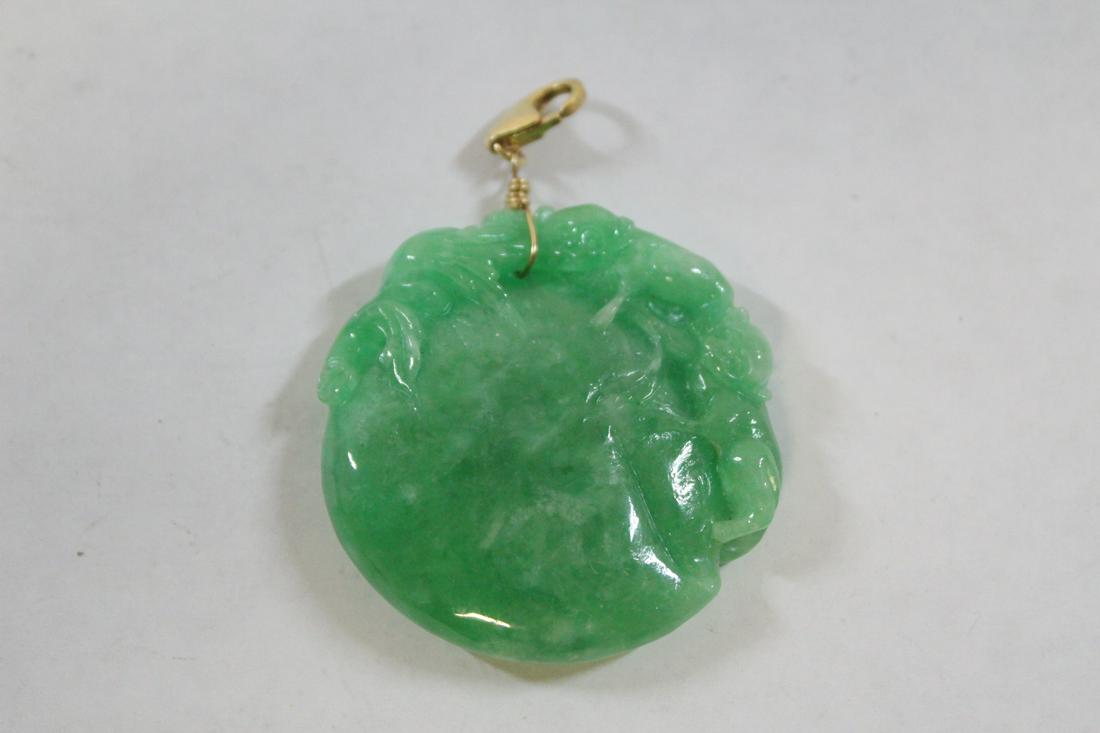 Chinese jadeite carving made as pendant: A fine Chinese jadeite carved ornament (0.37"x1.8"dia) made as pendant