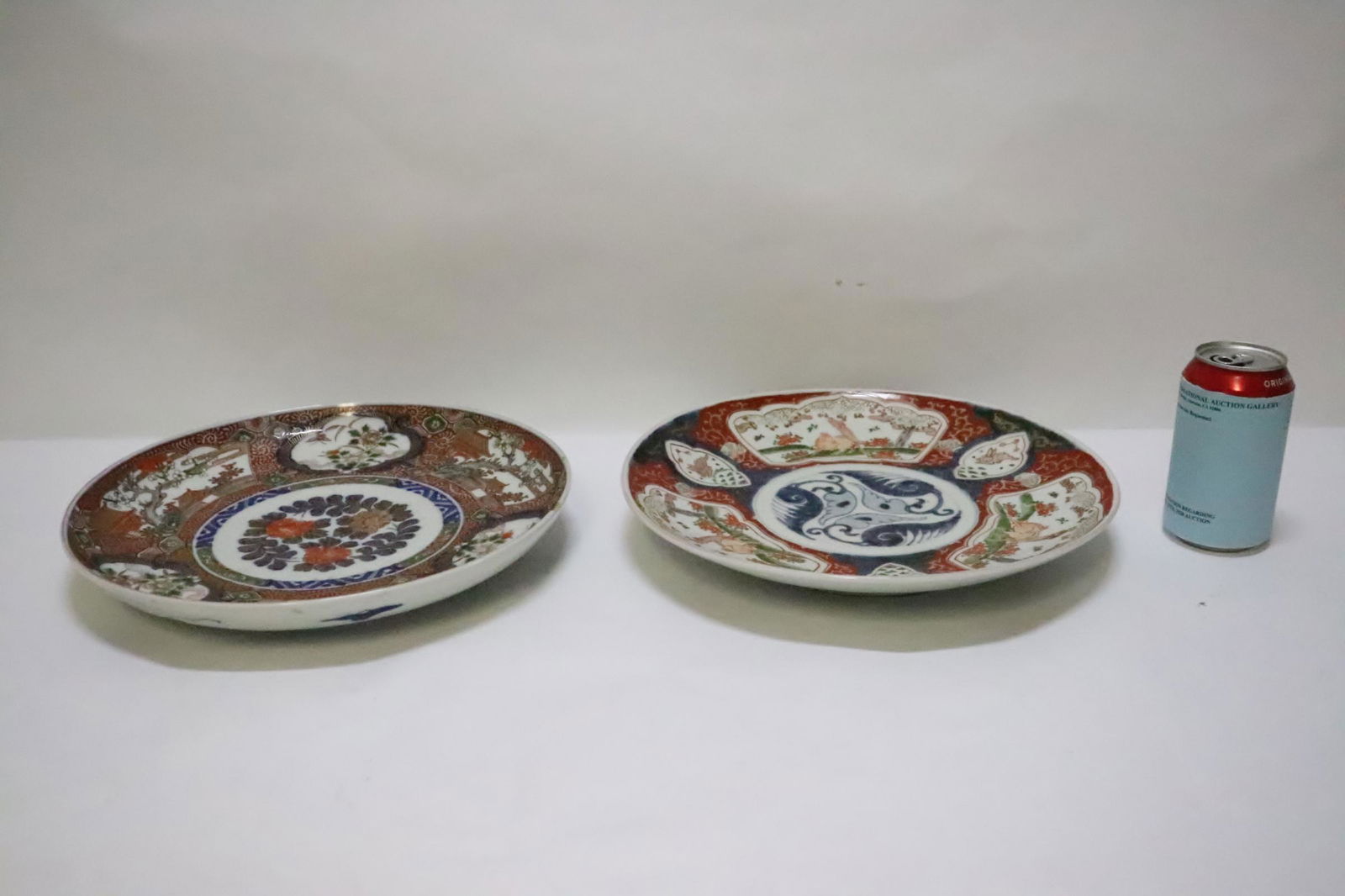 2 Chinese antique imari plates, one edge has chip: 2 Chinese antique imari plates, one edge has chip, 1.95"Hx12.25"dia each