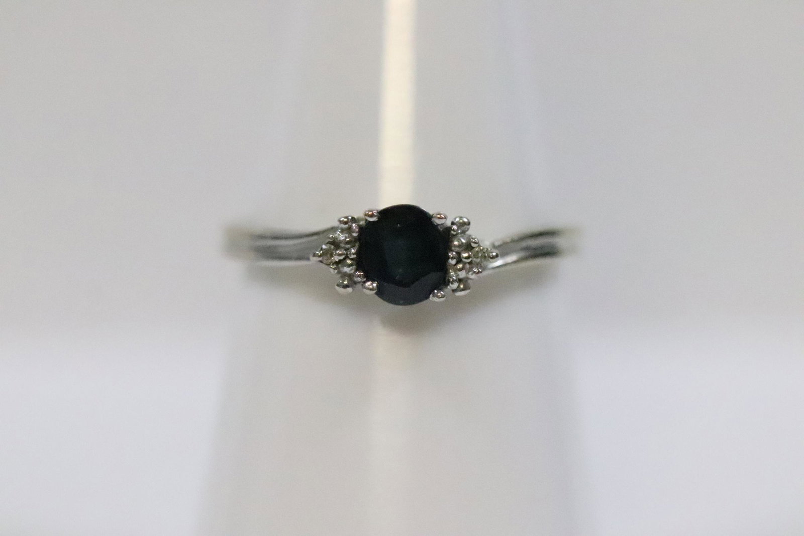 10K W/G sapphire ring, accented by small diamonds (1 of 9)