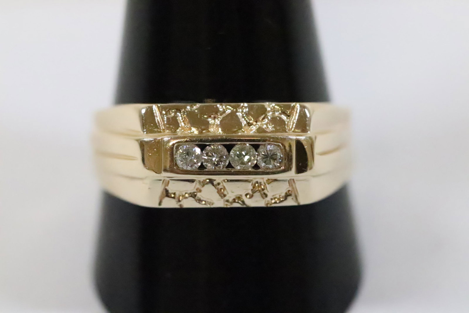 14K Y/G man's diamond ring: 14K Y/G man's diamond ring set with 4 small diamonds, wt. 3.7gm, size 11