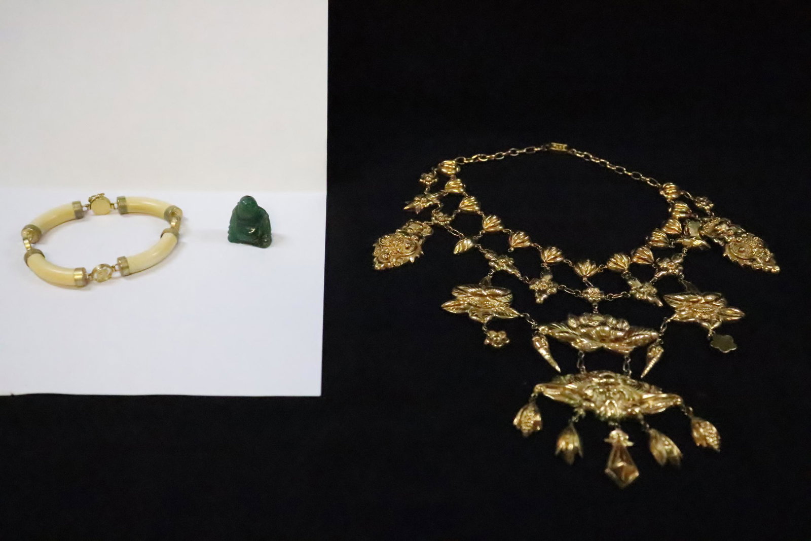 3 items: Asian style gilt metal necklace, Asian style bracelet and a jadeite like Buddha (0.95"H)