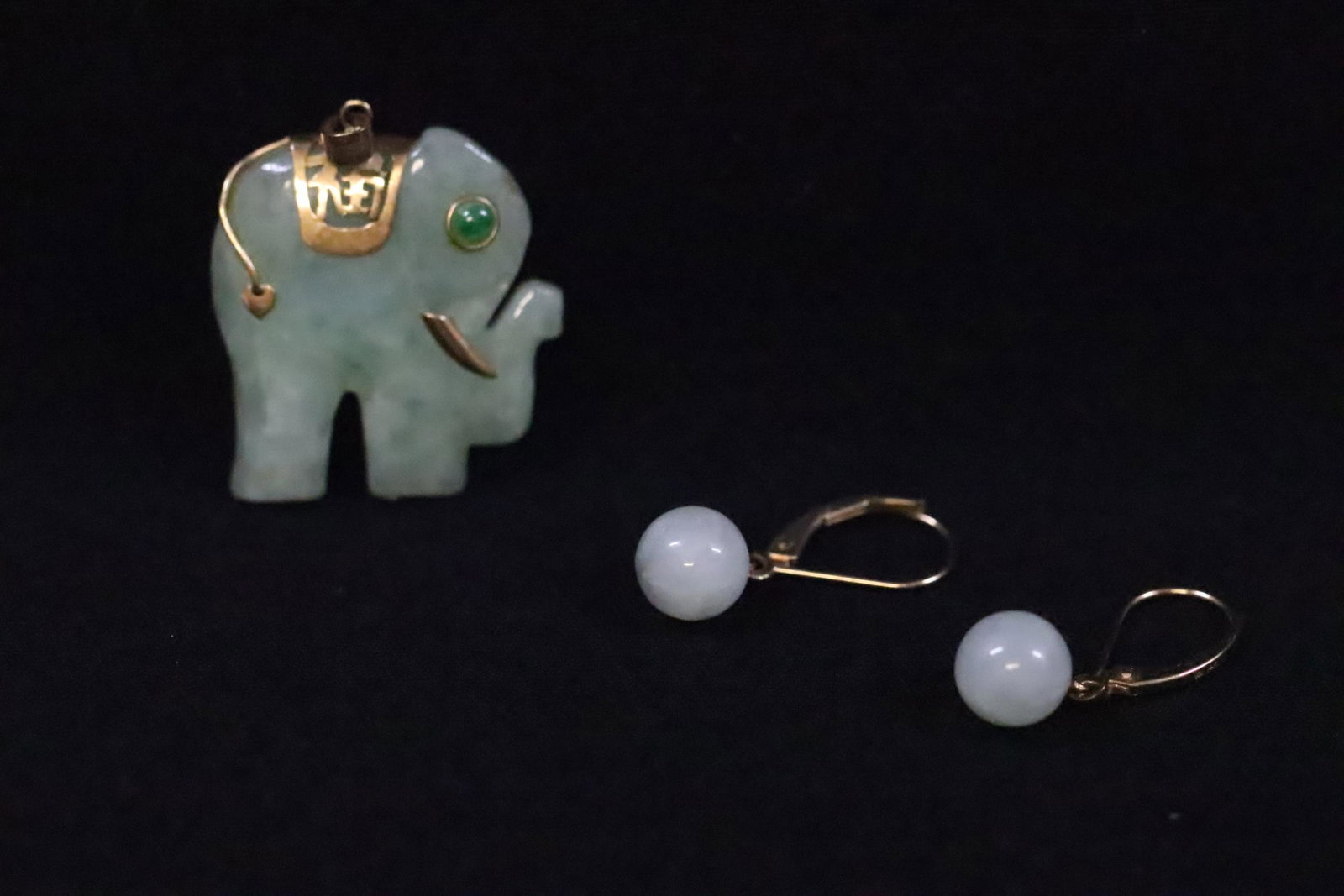 Pr 14K jadeite earrings and a 14K jadeite pendant: Pair 14K Y/G jadeite earrings with jadeite bead measures 8.3mm diameter, and a 14K jadeite pendant with jadeite carved in elephant motif