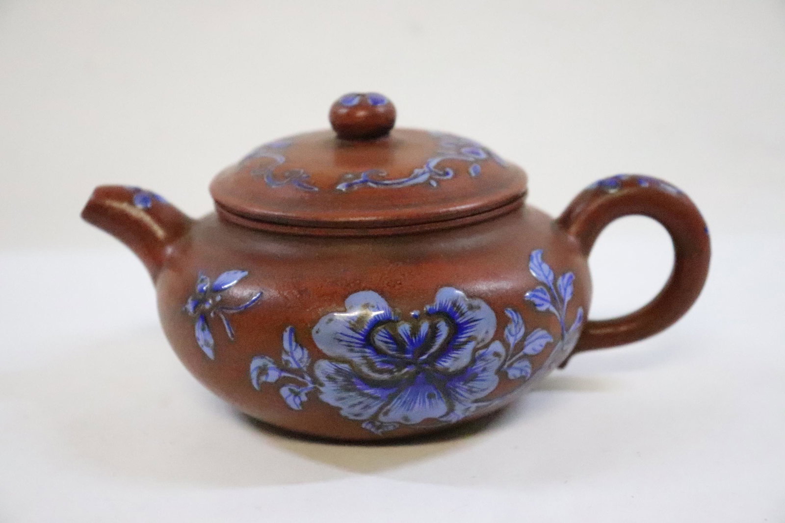 A Yixing teapot: A Yixing teapot, 3.3"Hx6.4"x4.45"