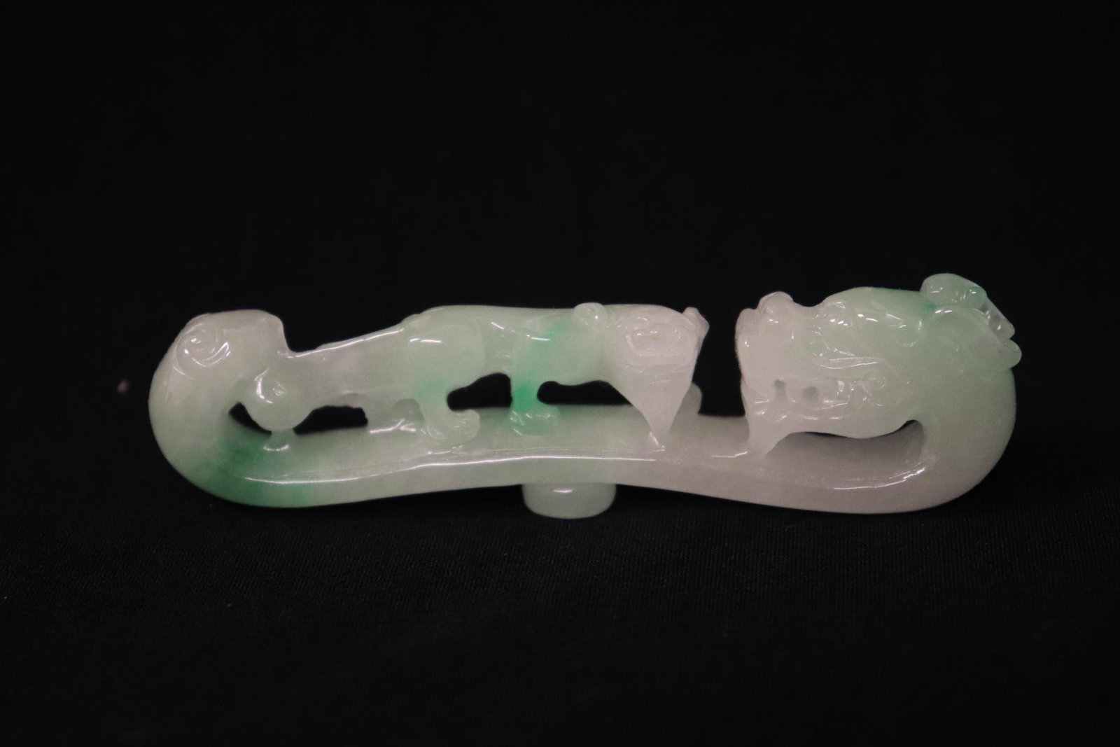 A fine jadeite carved belt buckle: A fine jadeite carved belt buckle, 3.5"L