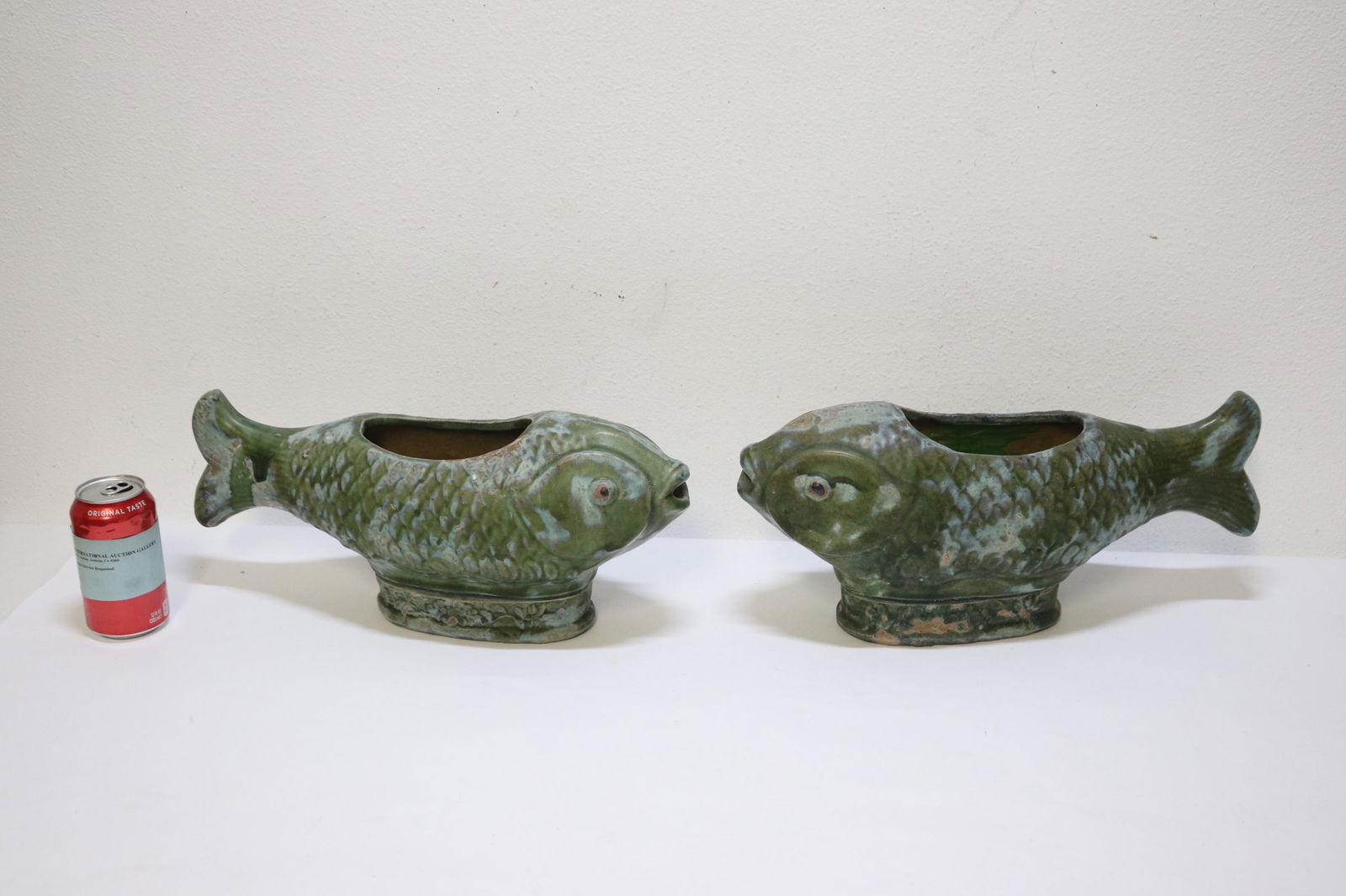 Pair Chinese green glazed pottery planters: Pair Chinese green glazed pottery planters in the form of fish, minor chips, 7.35"Hx16.5"x5" each