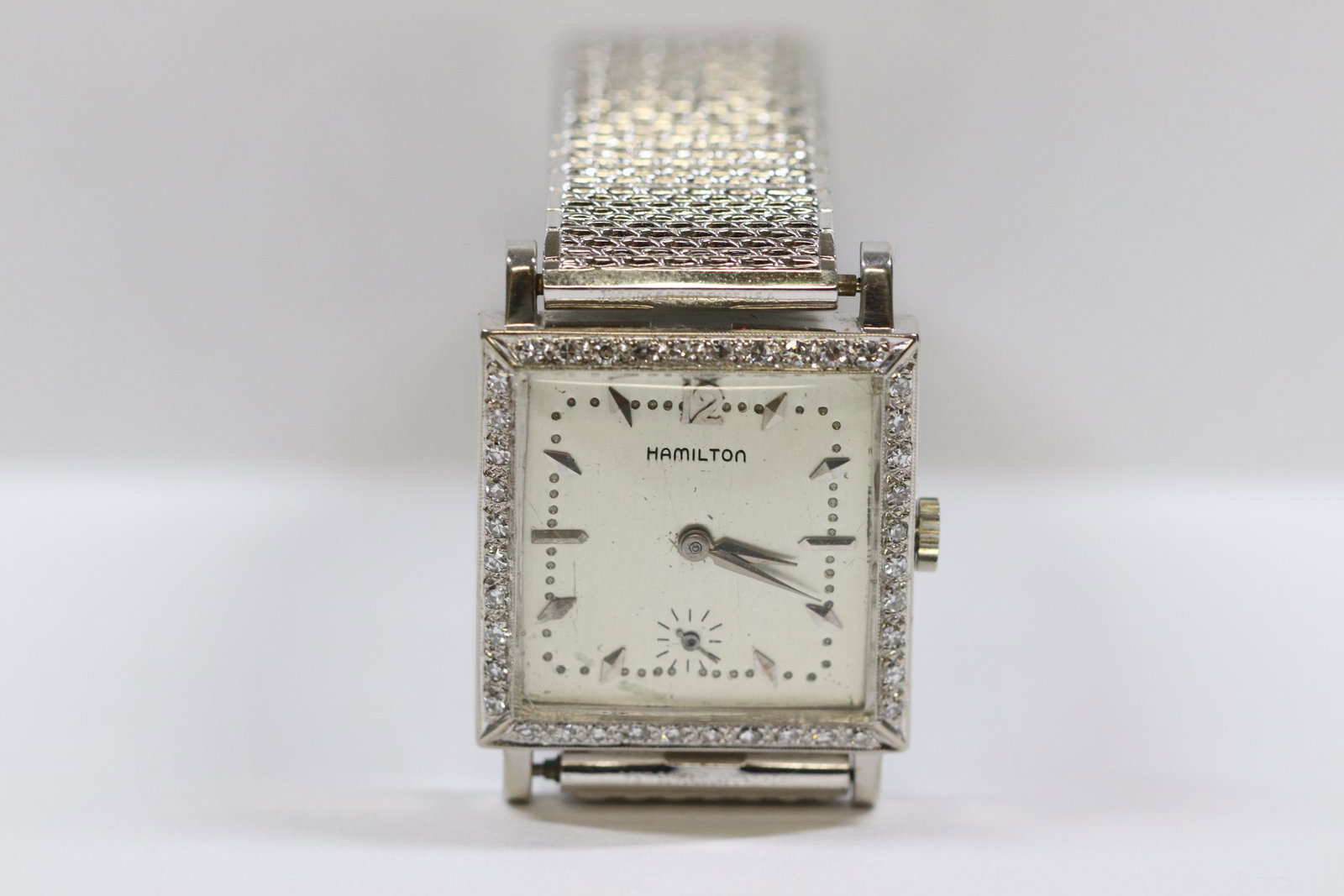 man's 14K W/G Hamilton diamond watch: Very nice man's 14K W/G Hamilton diamond watch set with 40 gem quality small diamonds, tdw approx. 1.0ct, wt. 43.7gm
