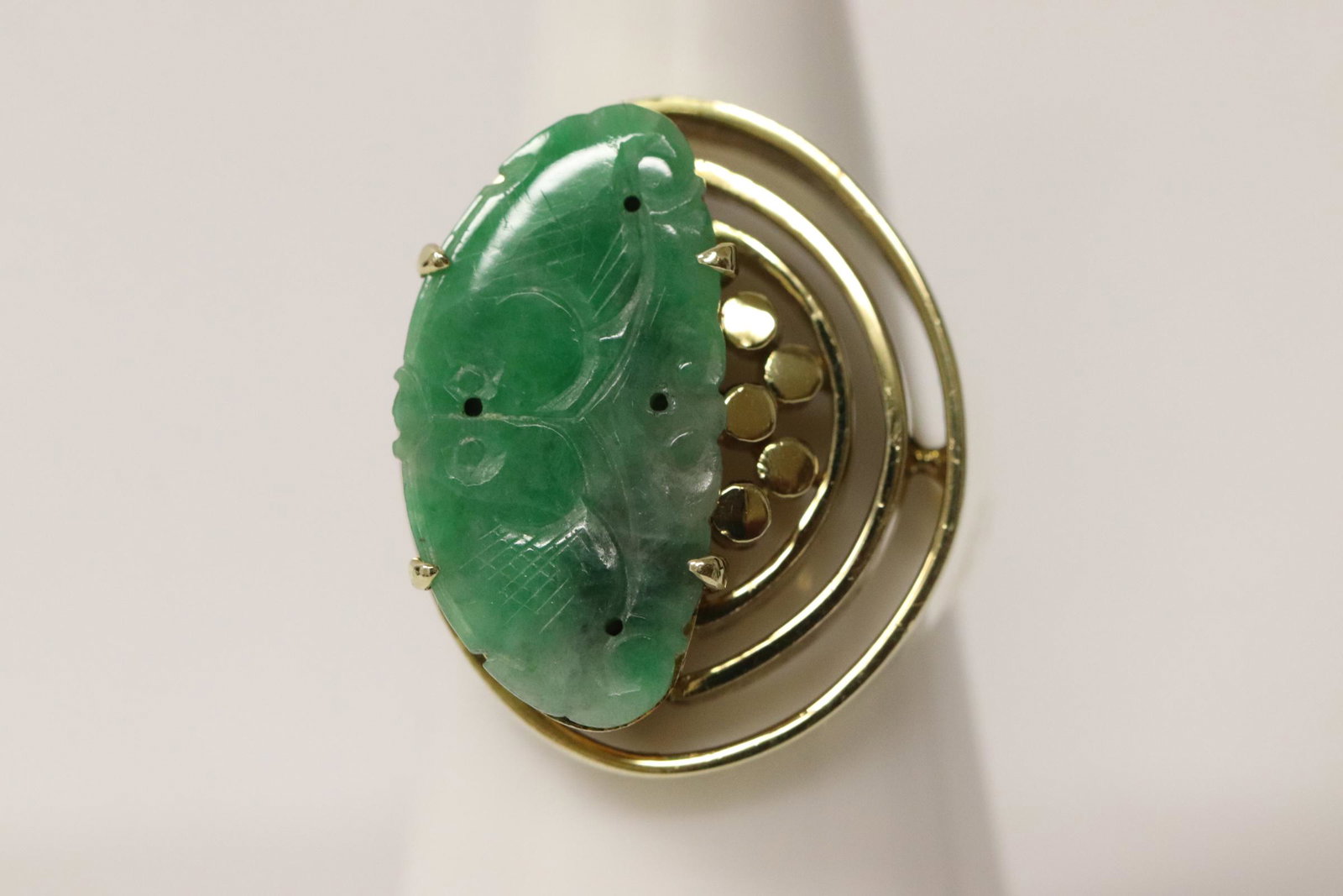 A beautiful retro 14K Y/G jadeite ring: A beautiful retro 14K Y/G ring, center a natural color apple green jadeite measures 21x10.5mm, wt. 9.0gm, size 6