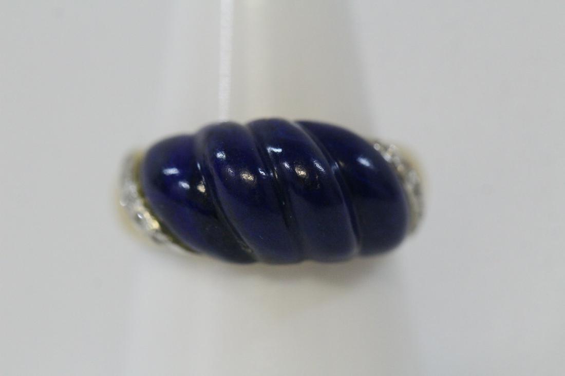 14K Y/G lapis diamond ring: 14K Y/G ring, center gem quality carved lapis accented by 10 small diamonds, wt. 6.0gm, size 7