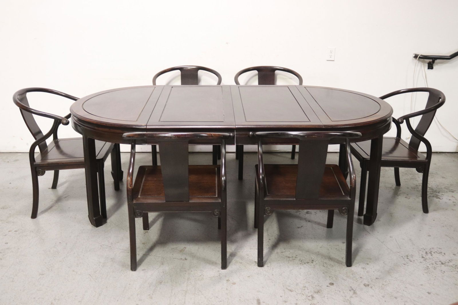 A beautiful Chinese 7 piece rosewood dining set: A beautiful Chinese 7 piece rosewood dining set; including center table (29"Hx45"dia, 2 ext. boards (45"x19.88" each)), and 6 large armchairs (32.25"Hx24.7"x24.25" each)
