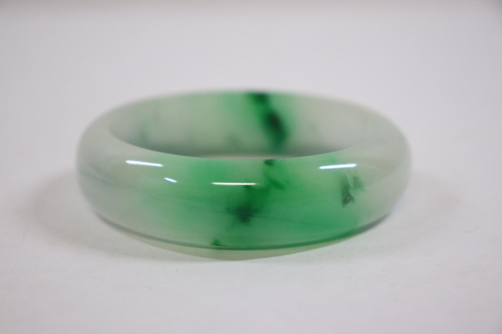 A jadeite like bangle: A jadeite like bangle, 0.65"x2.9"od(2.33"id)