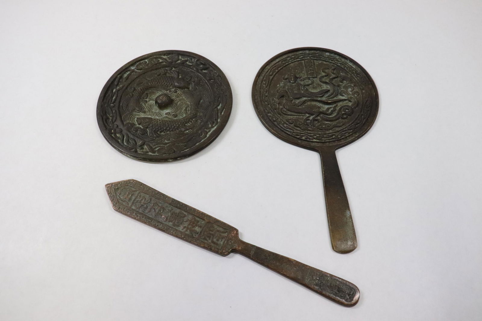 2 bronze mirrors, and a bronze ornament (1 of 10)