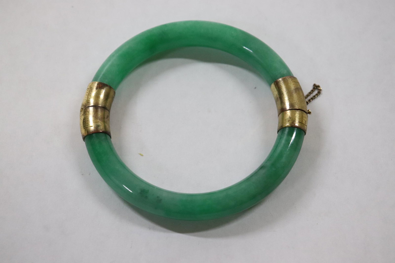 A jadeite bangle: A jadeite bangle, 0.38"x2.85"od(2.17"id)