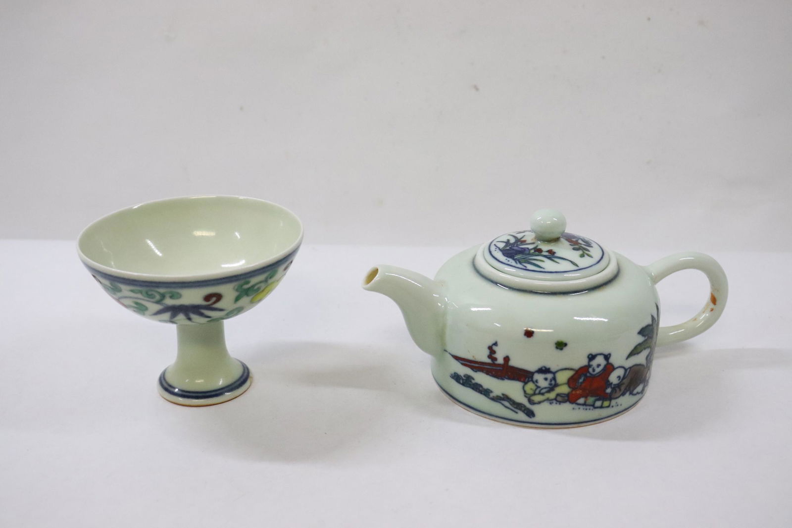 A wucai porcelain teapot and a porcelain stem bowl (1 of 11)