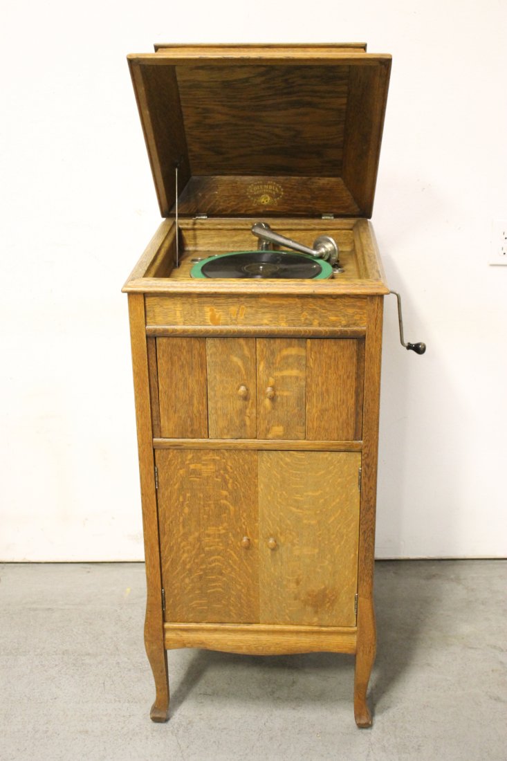 Victorian tiger oak framed record player: Victorian tiger oak framed record player with record storage compartment 42.75"Hx19.25"x21.25"