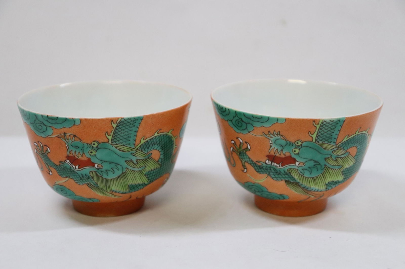 Pair Chinese famille rose porcelain tea cups: Pair Chinese famille rose porcelain tea cups with dragon, 2.3"Hx3.38"dia each