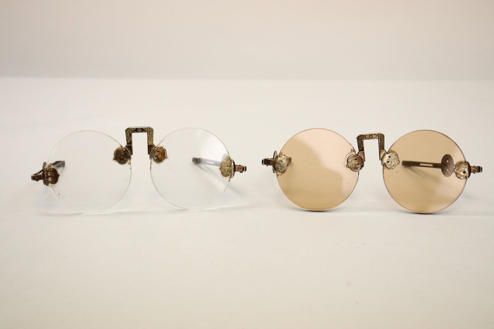 2 pairs bronze/ brass framed sunglasses: 2 pairs bronze/ brass framed sunglasses, 5.75"x2.2", 5.65"x2.2"