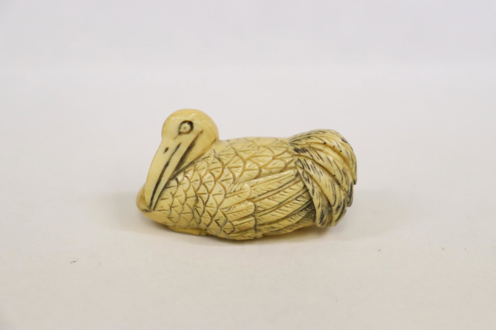 Vintage Japanese bone carved netsuke: Vintage Japanese bone carved netsuke depicting waterbird (1.6"L)