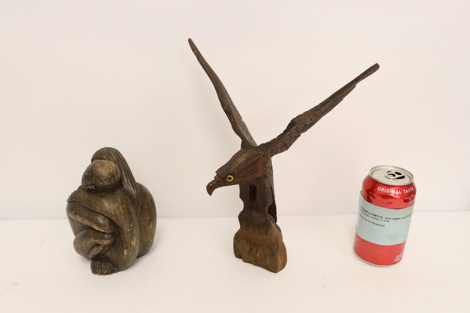 2 wood carvings,; "lover" and eagle: 2 wood carvings,; "lover" (5.8"H) and eagle (10.75"H)
