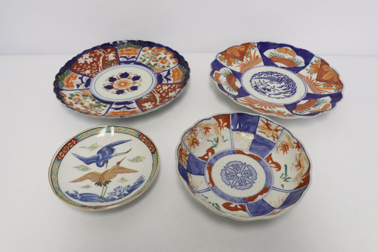 4 Japanese antique imari plates: 4 Japanese antique imari plates (one has chip), 0.95"Hx5.15"dia - 1.35"Hx8.6"dia