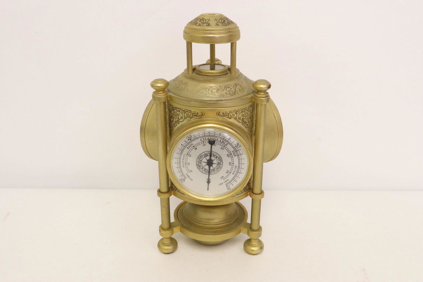 A brass clock/ thermometer/ barometer (1 of 10)
