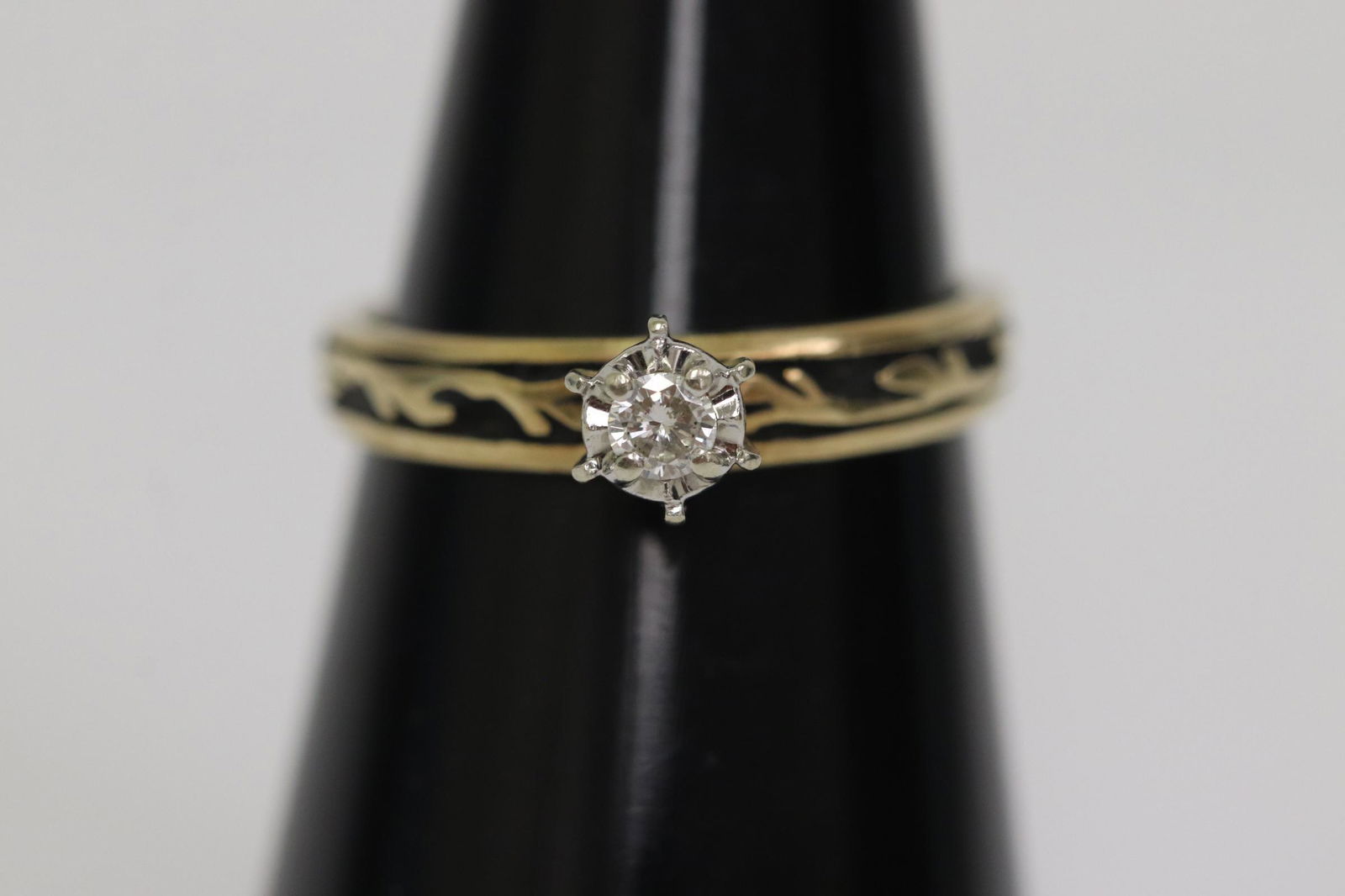 10K Y/G ring, center a fine brilliant cut diamond (1 of 9)