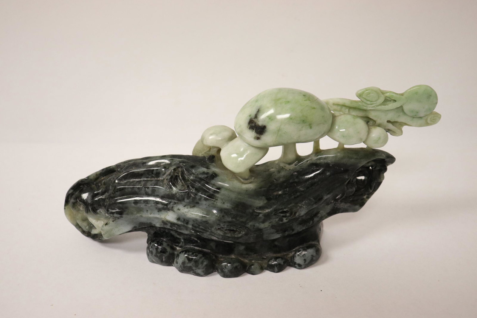 Chinese jadeite carving depicting lingzhi on rock: Chinese jadeite carving depicting lingzhi on rock, 4.8"x10.4"x2.45"