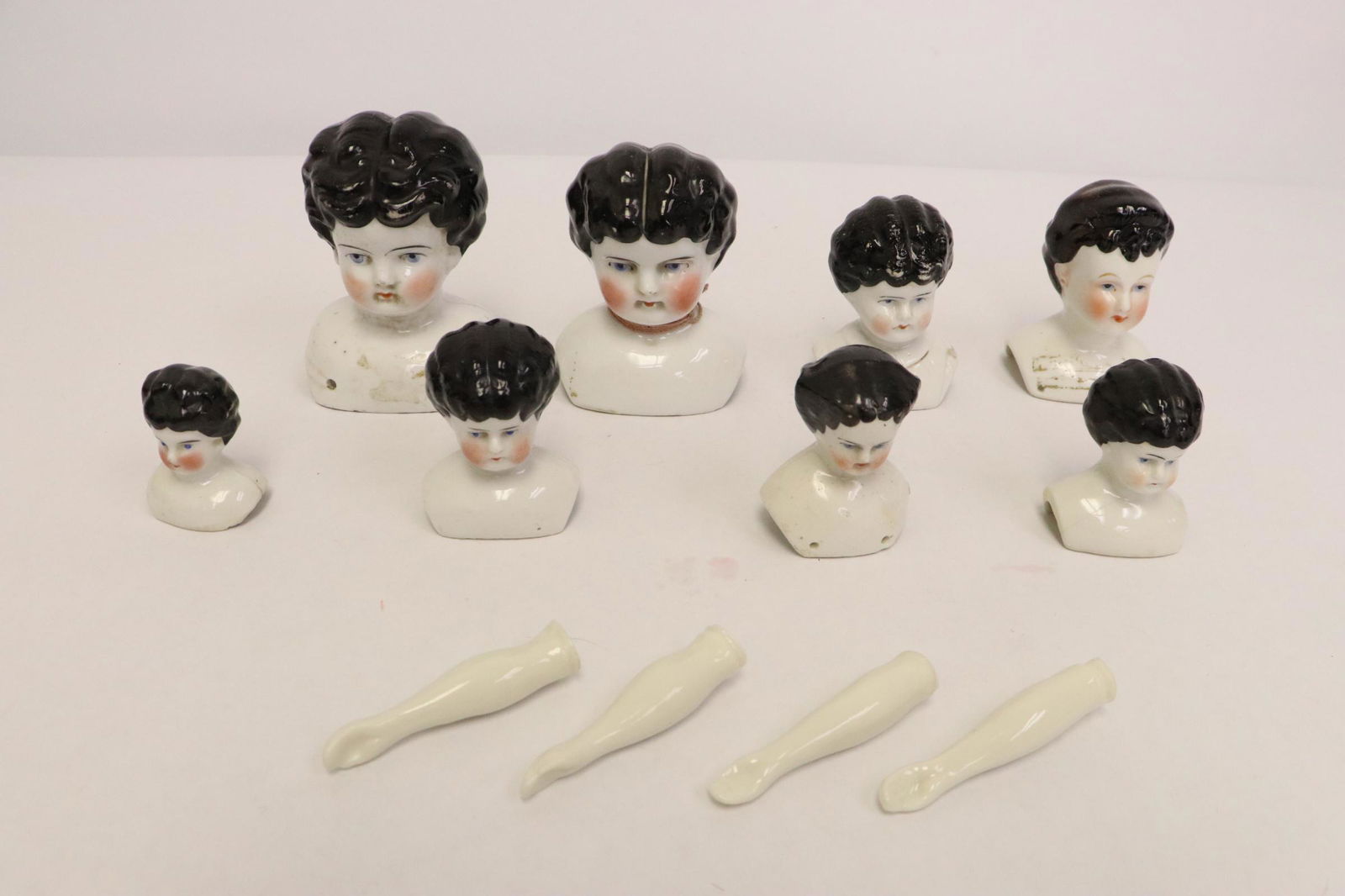 8 antique German porcelain doll heads and 2 pairs hands (1 of 10)