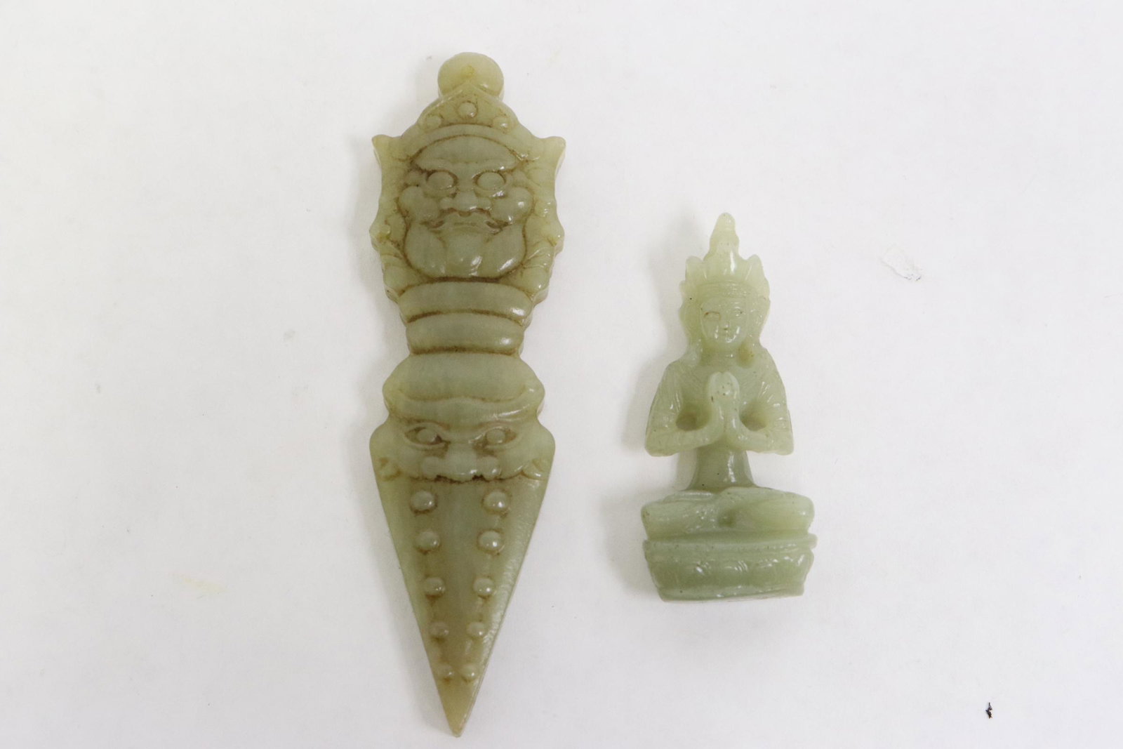2 Chinese jade carvings depicting deity motif (1 of 9)