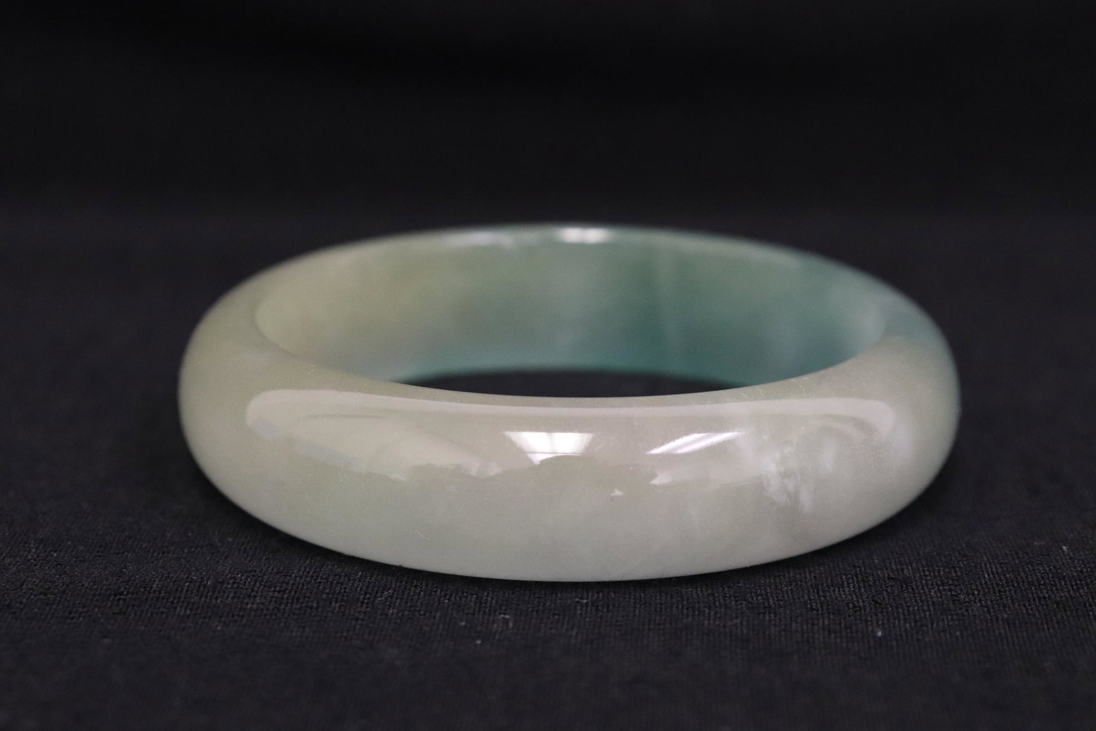 A jadeite like bangle: A jadeite like bangle, 0.63"x2.9"od(2.33"id)