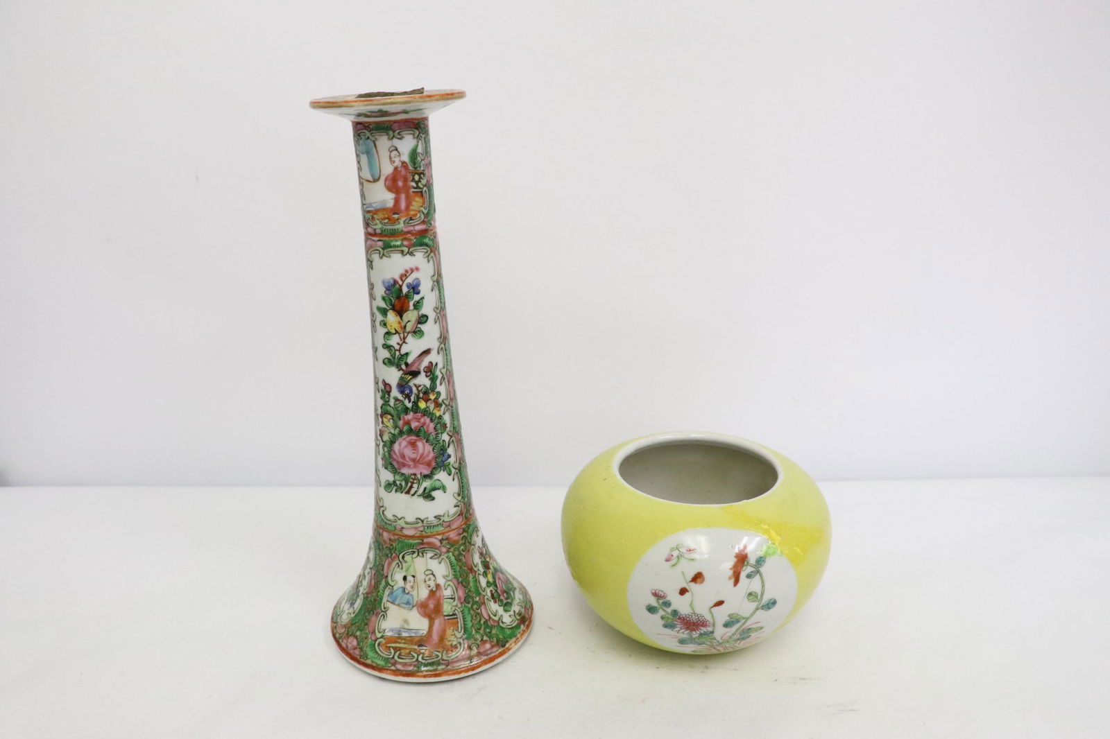 Chinese antique porcelain water dripper, & a candle: Chinese antique blue background famille rose water dripper (damage, repair, 3.5"Hx5.15"dia), and a famille rose candle holder (chips, 10.25"Hx4.13"dia)