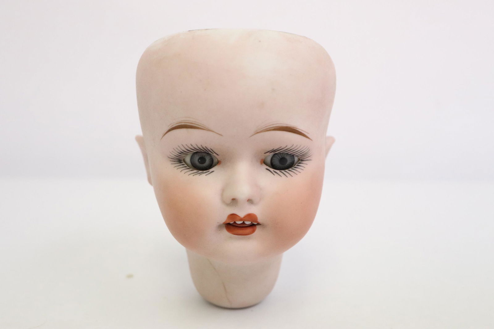 Antique German bisque doll head, hairline (1 of 10)