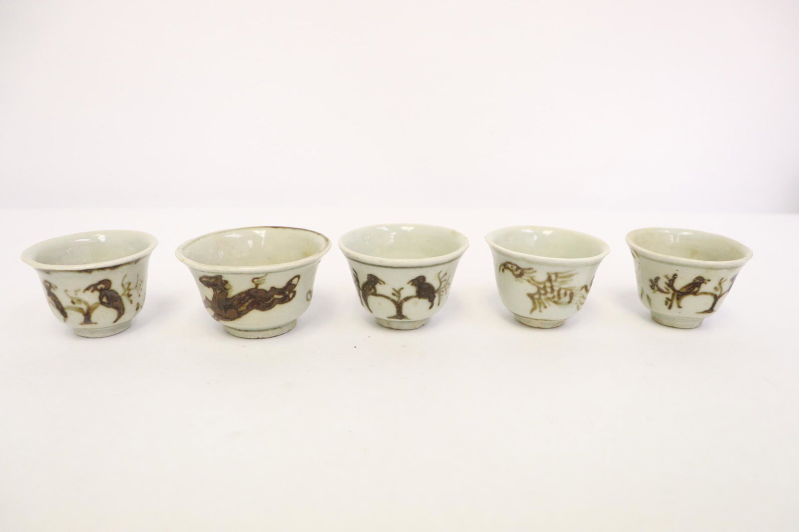 5 antique red and white porcelain wine cups: 5 antique red and white porcelain wine cups, 1.45"Hx2.1"dia - 1.45"Hx2.55"dia