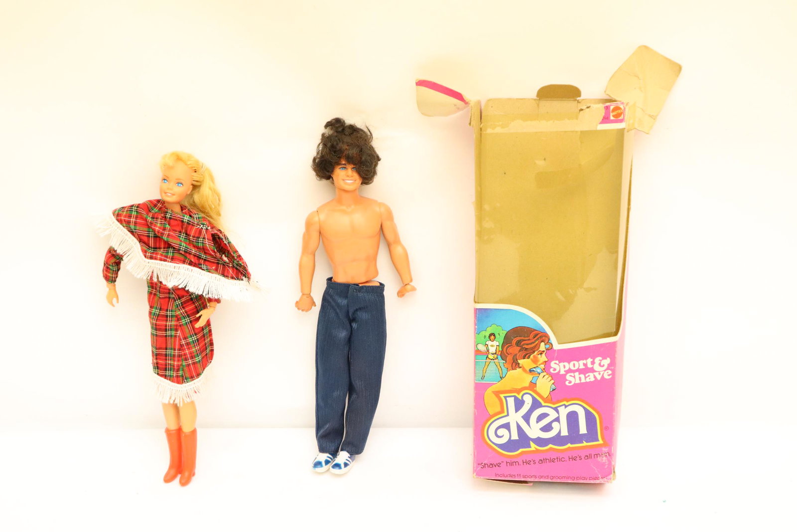 A vintage Ken doll and a vintage Barbie doll: A vintage Ken doll and a vintage Barbie doll