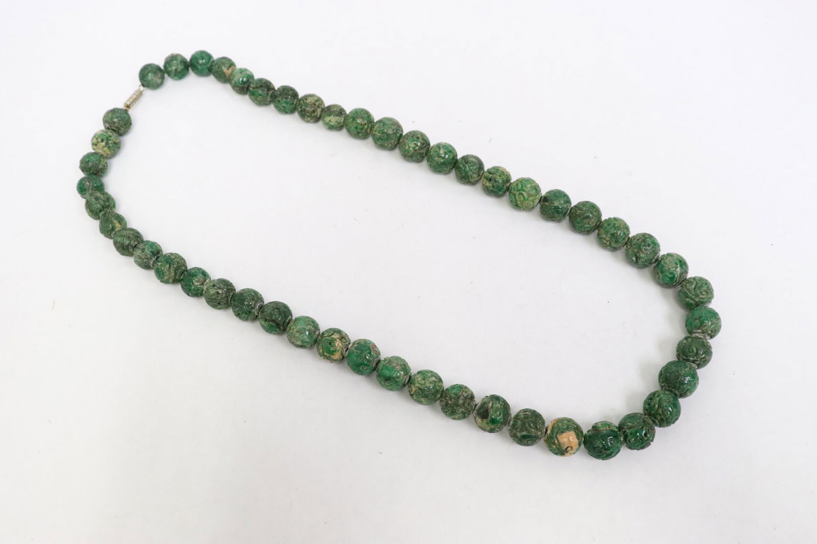 A jadeite like stone carved bead necklace (1 of 10)