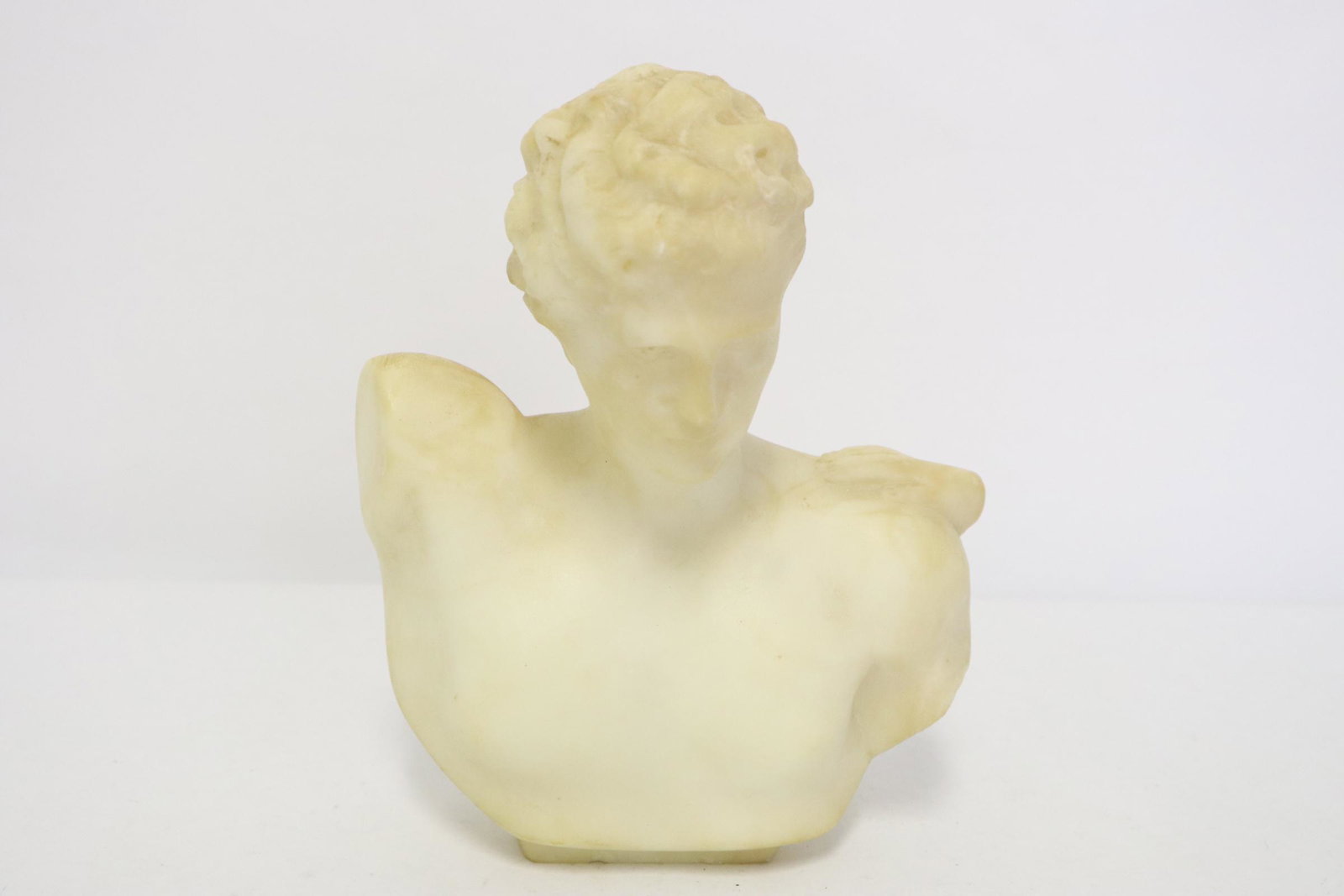 An alabaster sculpture of bust: An alabaster sculpture of bust, chips 6.5"H