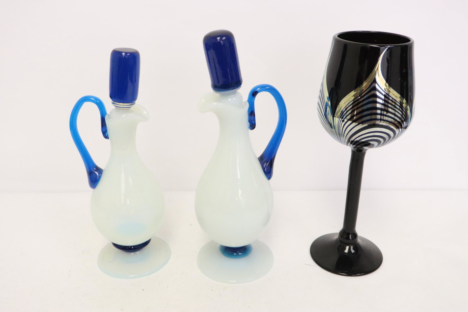 2 cologne bottles, and an art deco wine goblet: 2 art glass cologne bottles (9"H, 9.6"H), and an art deco wine goblet (9.25"Hx3.35"dia)
