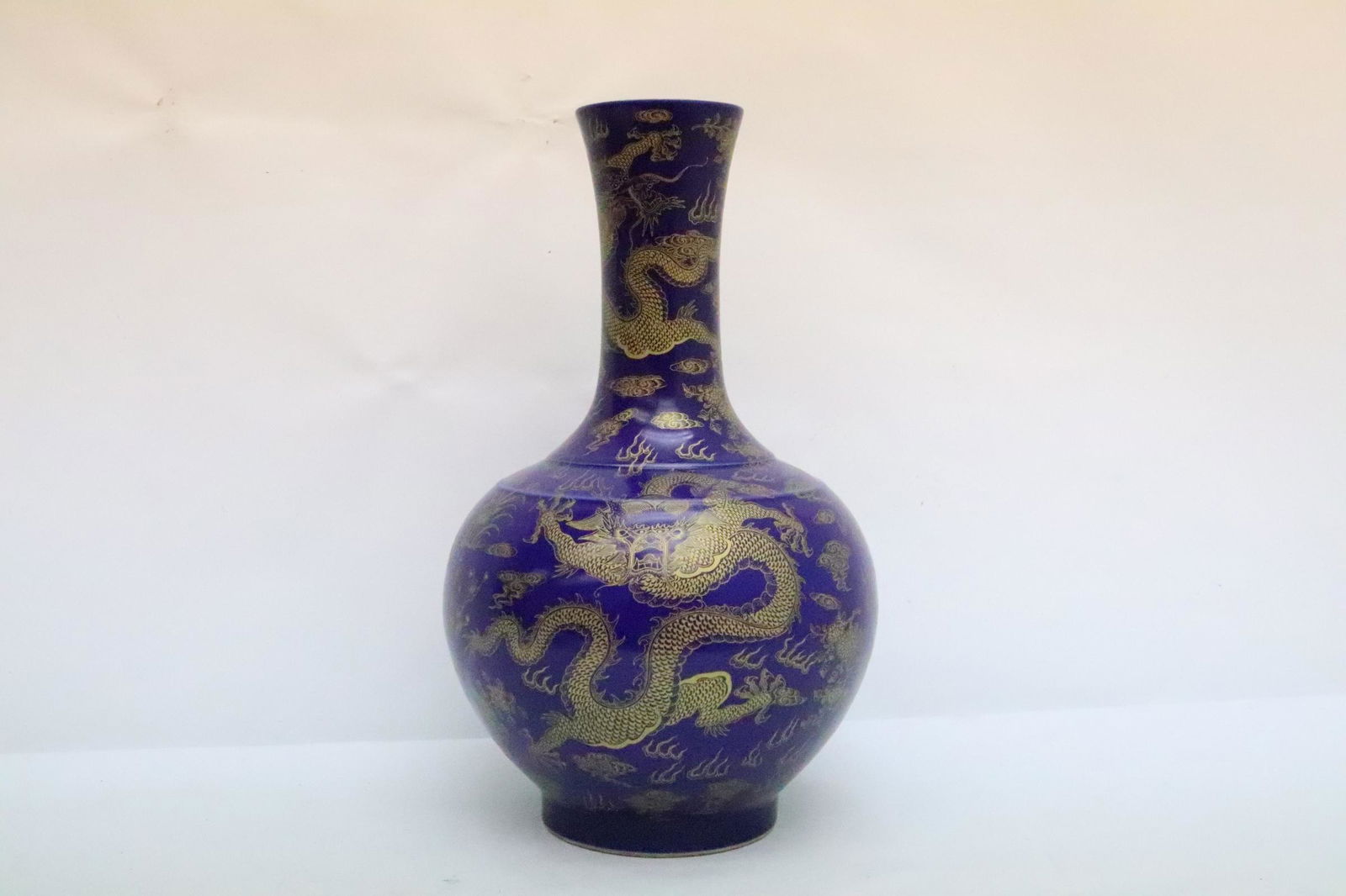Chinese gold on blue porcelain bottle vase: Chinese gold on blue porcelain bottle vase, 15.85"Hx9.5"dia