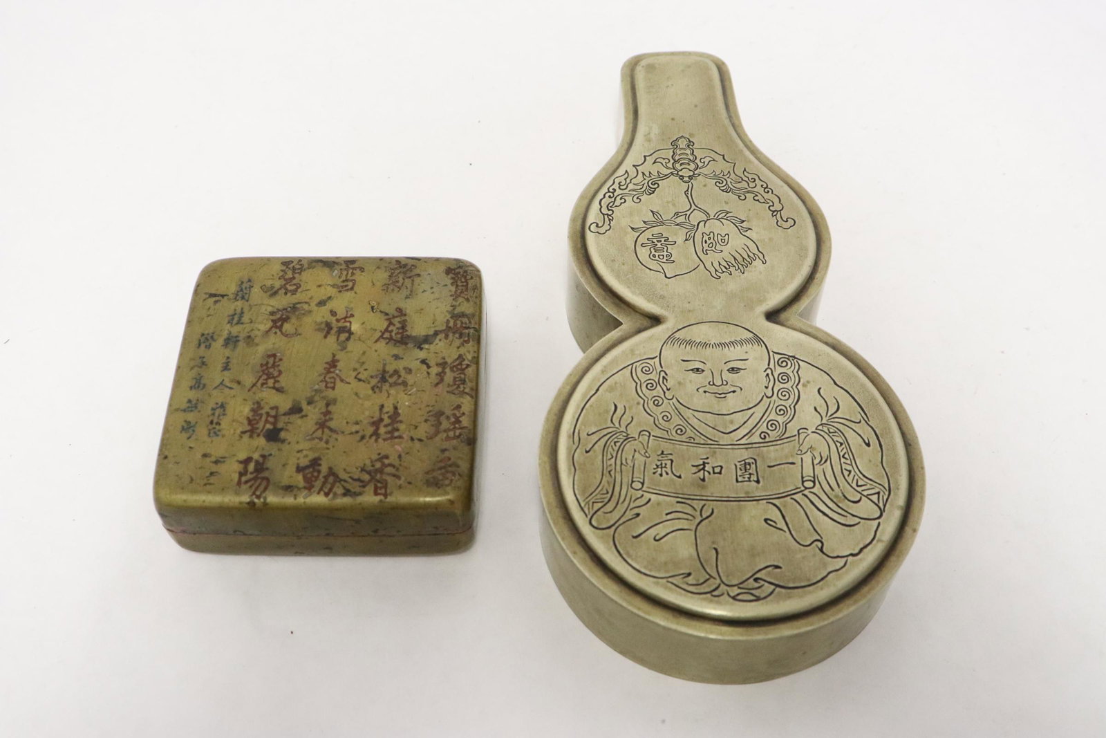 2 Chinese brass ink paste boxes: 2 Chinese brass ink paste box engraved with figure and calligraphy, 1.1"Hx2.95"x2.95", 1.25"x7.25"x3.5"